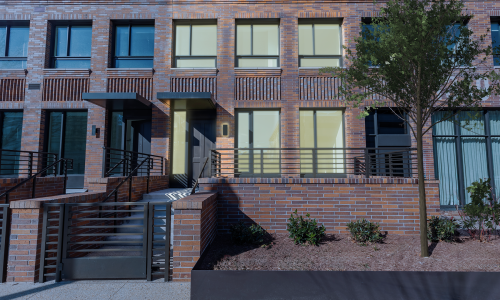 exterior view of townhome with gated entrance and terrace at a DC rental townhome