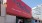 a large red sign on a building J Coopers Row SW DC luxury apartments at Nationals Park 